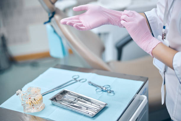 istock Female dentist getting ready for treating patient 1270675649