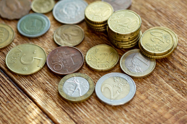 istock coins old rusty brass euro Seychelles Bulgaria China Germany pile pack heap stack on a wooden background finance economy investment savings concept mock up selective focus close up 1270678836