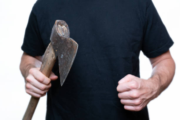 istock man on a white background holding an ax in his hand, selective focus 1270679466