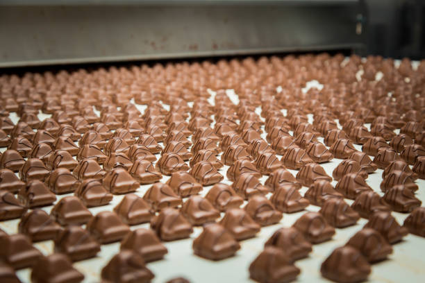 istock Sweets factory. Sweets production process. Conveyor belt with sweets on it. 1270680506