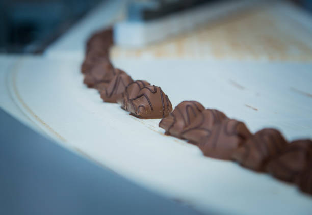 istock Sweets factory. Sweets production process. Conveyor belt with sweets on it. 1270680663