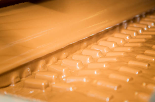 istock Sweets factory. Sweets production process. Conveyor belt with sweets on it. 1270680732