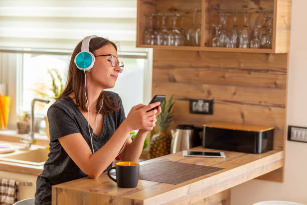 istock Woman wearing a headset using a smart phone 1270681937