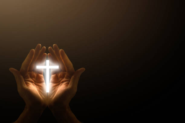 istock Light in the human hands in the dark 1270682360