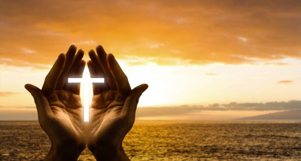 istock Light in the human hands in the dark 1270682404