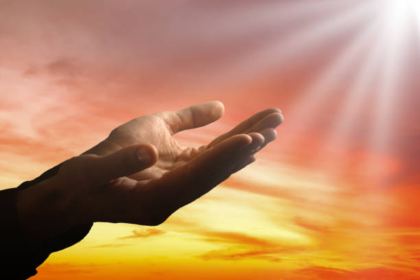 istock Light in the human hands in the dark 1270682950