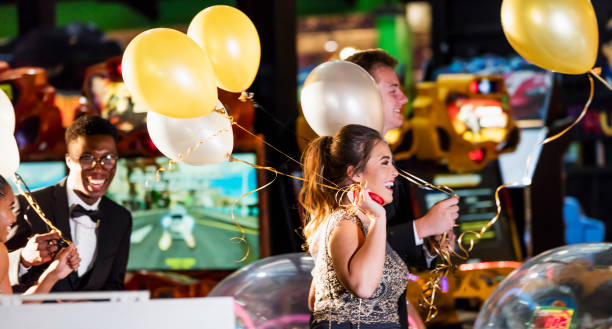 istock Teenagers after prom at video arcade 1270684565