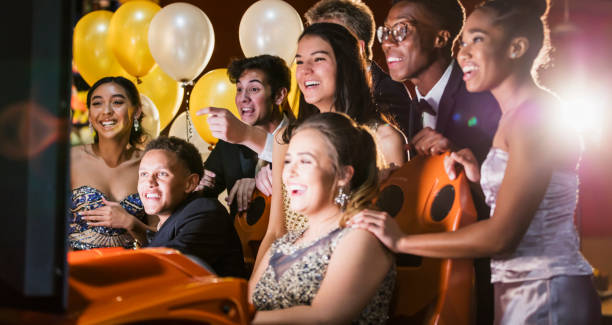 istock Teenagers after prom at video arcade 1270684617