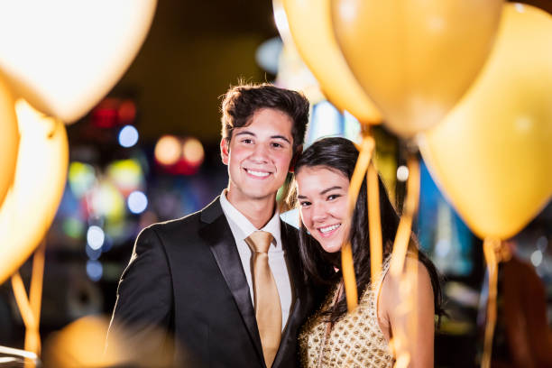 istock Teenage couple having fun at prom 1270684621