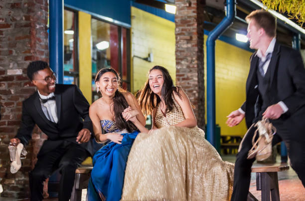 istock Two couples after prom, hanging out outside 1270684710