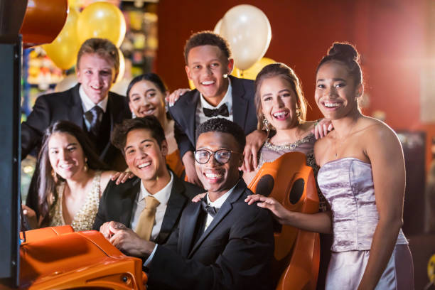 istock Teenagers after prom at video arcade 1270684840