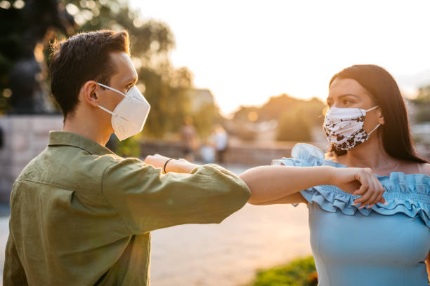 istock Couple greeting with elbow bump on date 1270684944
