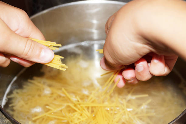 istock cooking spaghetti in a saucepan close up 1270685961