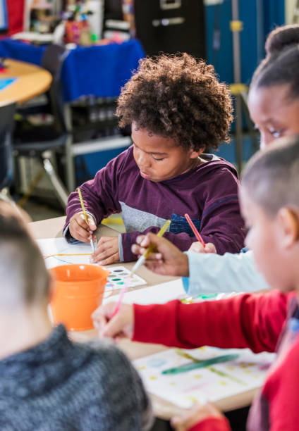 istock African-American boy with classmates in art class 1270685968