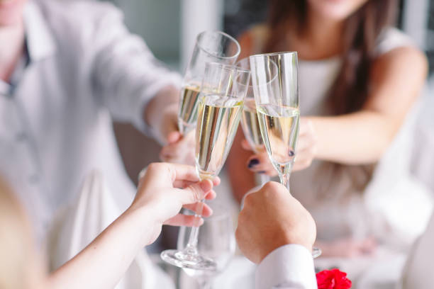 Friends in the restaurant having a toast. stock photo