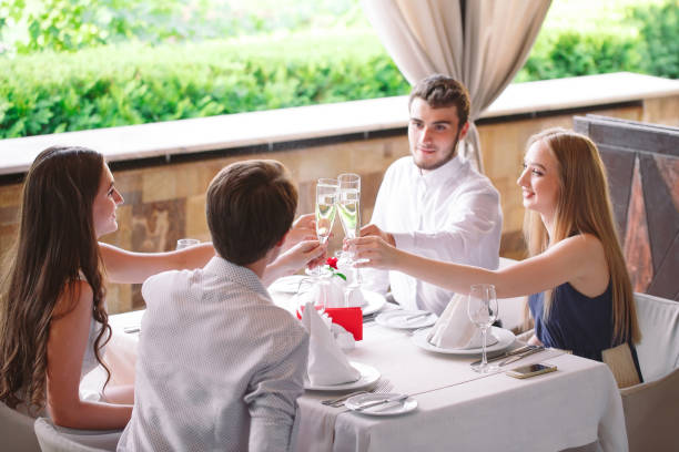istock Friends in the restaurant having a toast. 1270687168