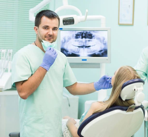 istock Doctor Dentist with an assistant work in a dental clinic 1270687753