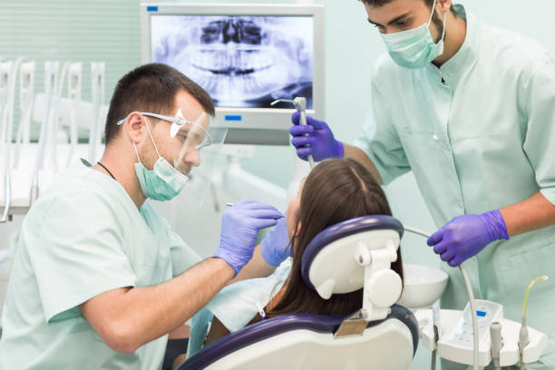 istock Doctor Dentist with an assistant work in a dental clinic 1270687978