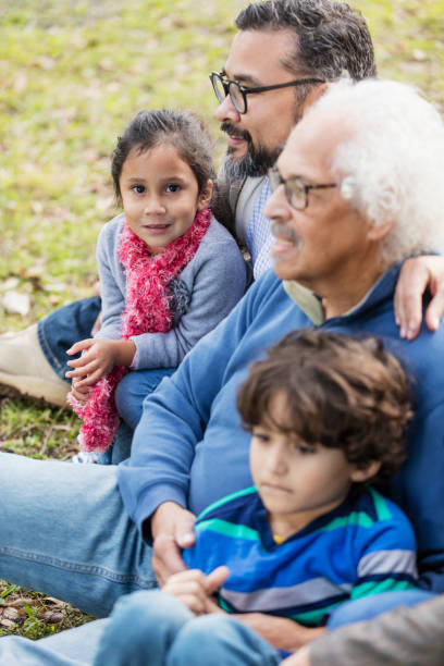 istock Three generation Hispanic family, girl looking at camera 1270688177