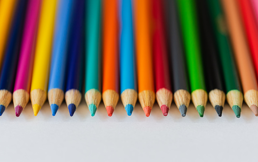 Close up of sharp tips of pencil crayons on white background. in Kingston, ON, Canada