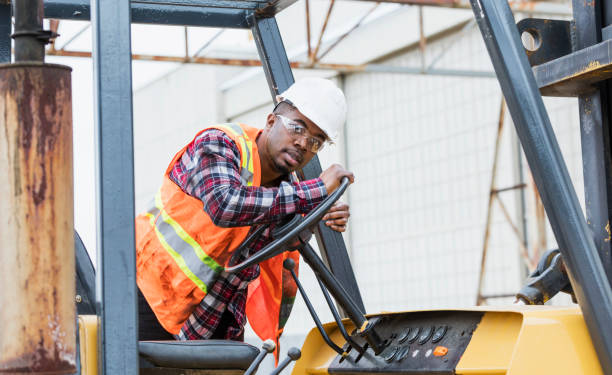 istock African-American man climbing onto forklift 1270689242