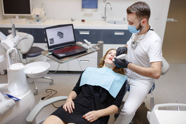 istock The dentist scans the patient's teeth with a 3d scanner 1270690292