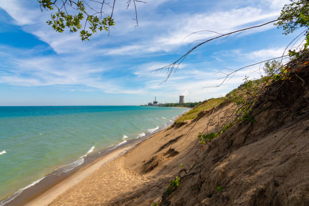 Lake Michigan Shoreline Sand dune meeting the shoreline of Lake Michigan.  Indiana Dunes National Shoreline sand dune stock pictures, royalty-free photos & images