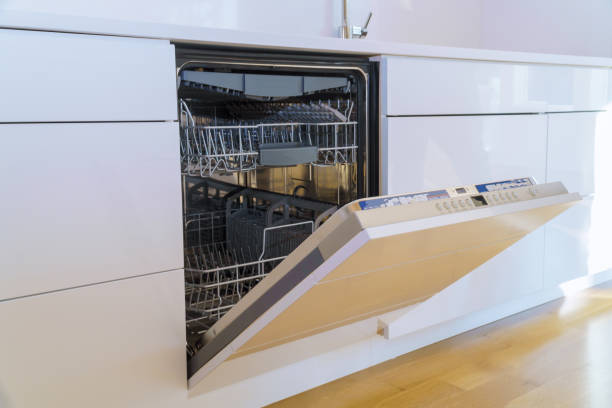 Modern domestic cabinets with new appliances dishwasher in kitchen
