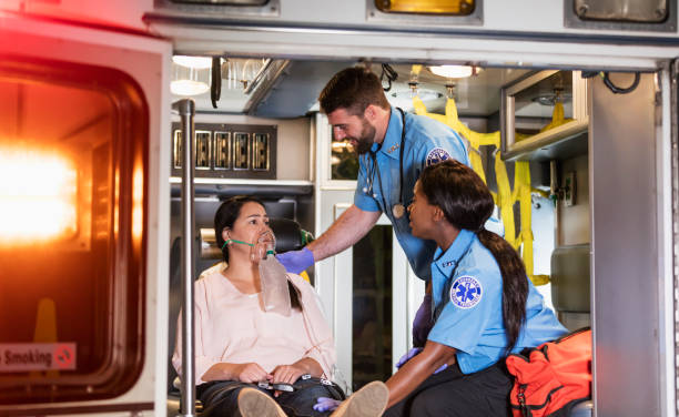 istock Paramedics helping woman in ambulance 1270691675