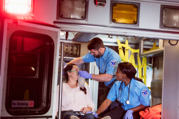 istock Paramedics helping woman in ambulance 1270691786