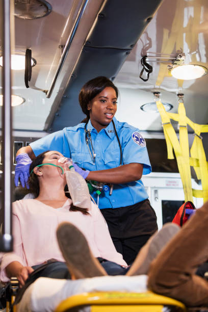 istock Paramedic helping Hispanic woman in ambulance 1270691899