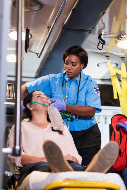 istock Paramedic helping Hispanic woman in ambulance 1270691950