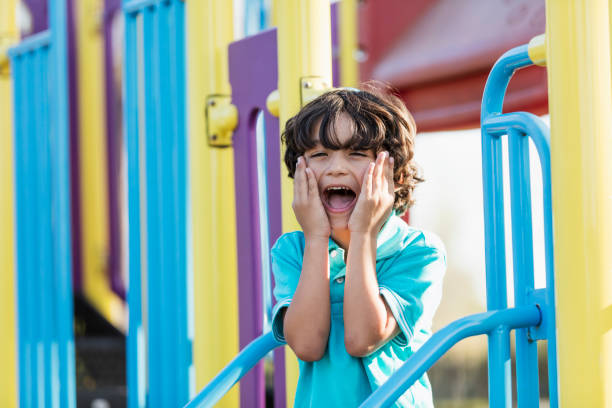 istock Happy Hispanic boy playing on playground 1270693649