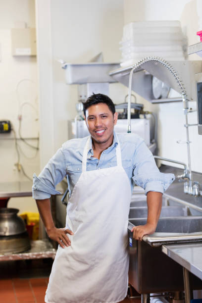 istock Hispanic and Filipino restaurant worker in kitchen 1270694432