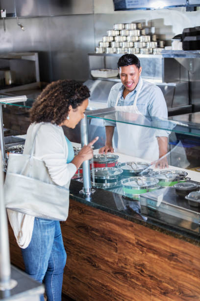 istock Hispanic customer ordering food in restaurant 1270694565