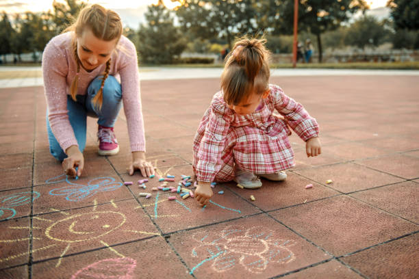 istock Single mother playing with her daughter in the park 1270697829