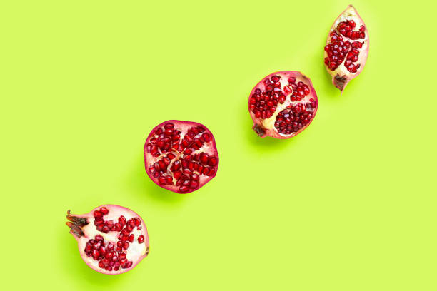istock Top view of ripe pomegranate fruit on green 1270698553