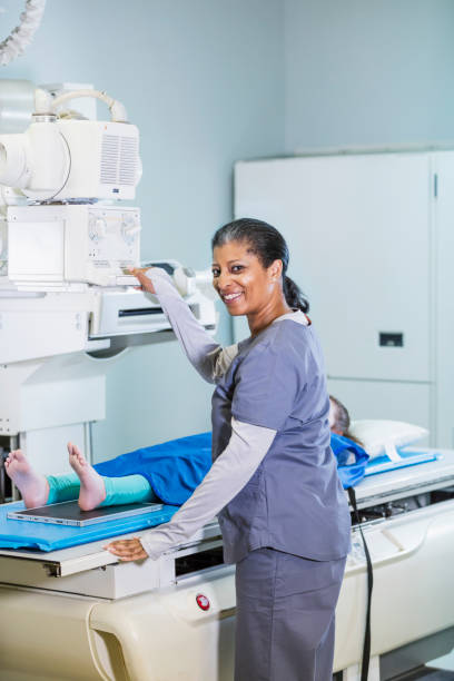 istock Technologist taking x-ray of girl's foot 1270698718