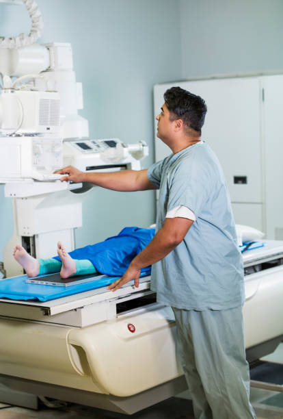 istock Technologist taking x-ray of girl's foot 1270698832