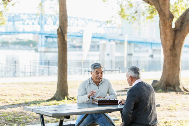 Hispanic men playing a game of checkers
