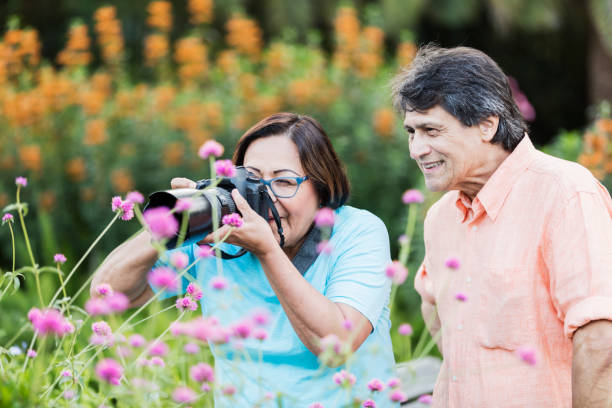 istock Senior Hispanic couple photographing nature 1270701892