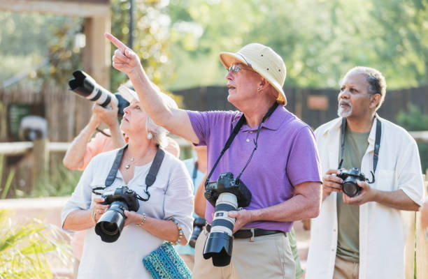 istock Couple with tour group taking photos 1270703113
