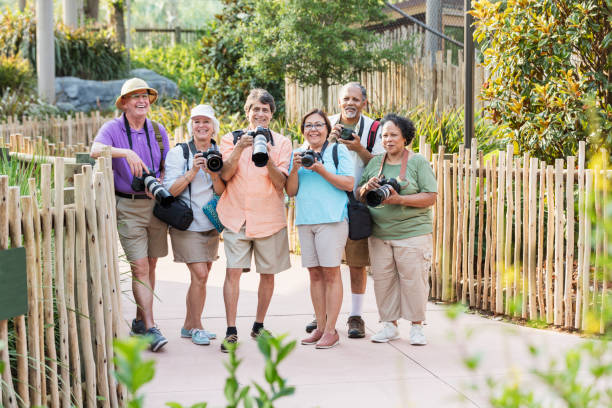 istock Group of seniors in park with cameras 1270703114