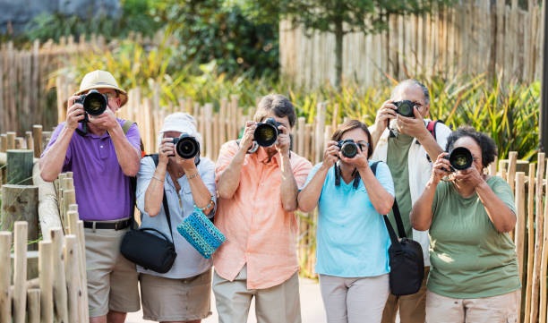 istock Group of seniors in park with cameras 1270703115