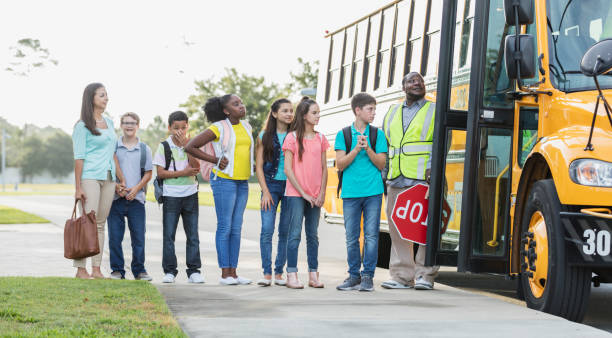 istock Middle school class boarding bus, boy with down syndrome 1270704686