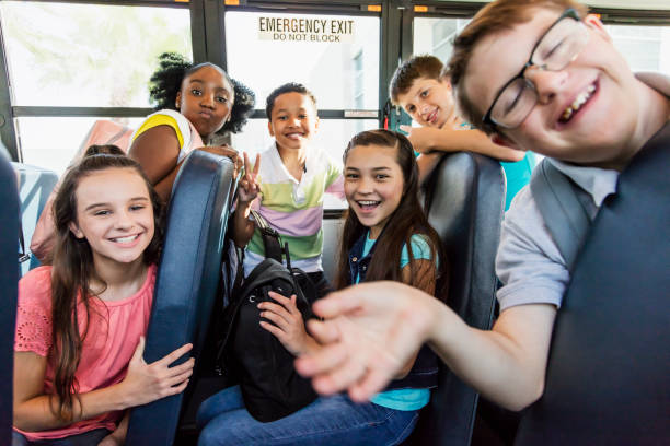 istock Students riding school bus, boy with down syndrome 1270704707