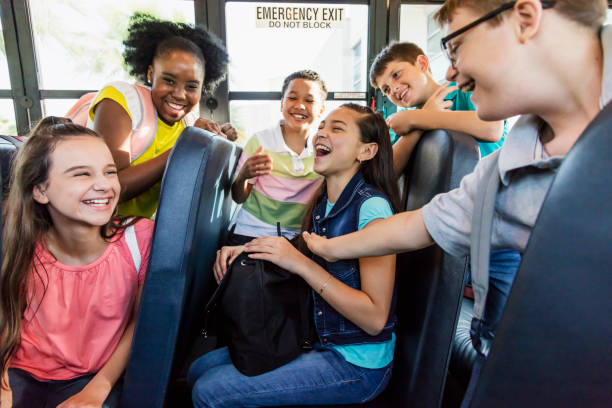 istock Students riding school bus, boy with down syndrome 1270704746