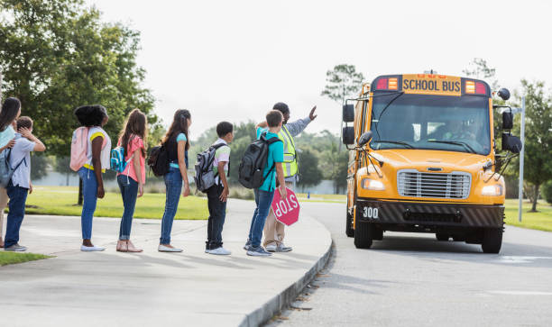 istock Middle school class wait for bus, boy with down syndrome 1270704747