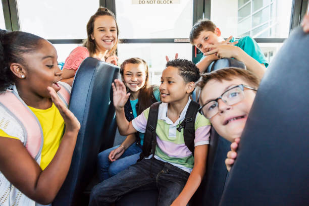 istock Students riding school bus, boy with down syndrome 1270704753