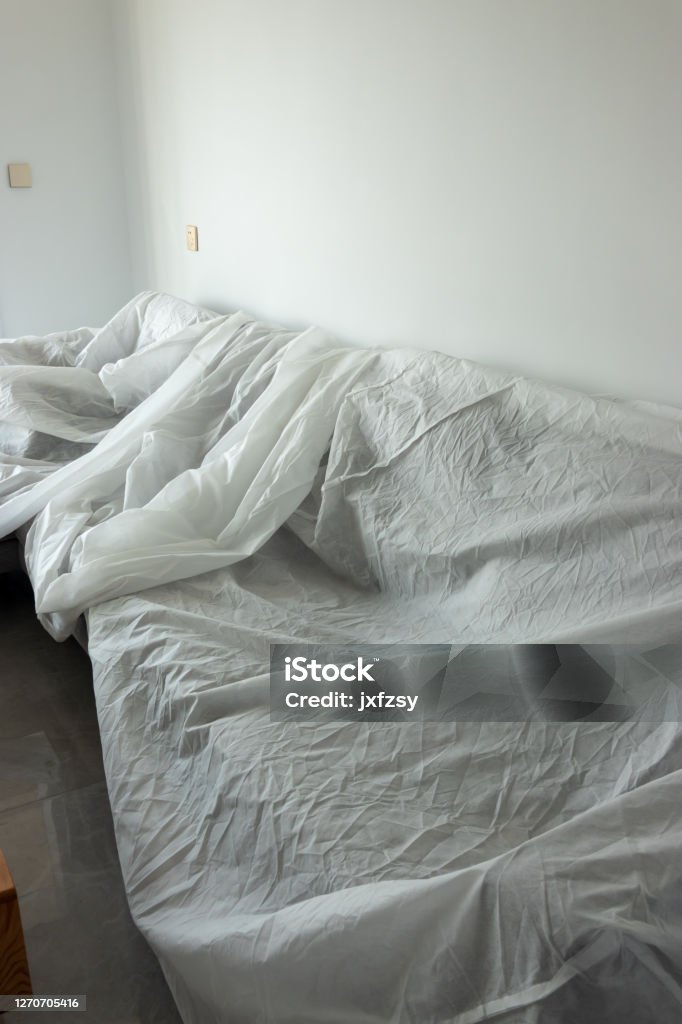 sofa covered with white cloth in homedecoration Apartment Stock Photo